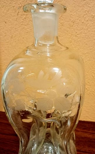 Antique hourglass shaped glass decanter