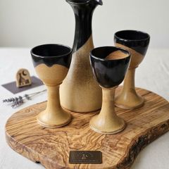Irish glazed pottery wine jug and glasses