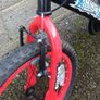 Children's black and red ninja bike Image 3