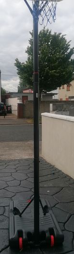 Basketball stand and two basketballs