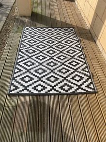 Two patio rugs