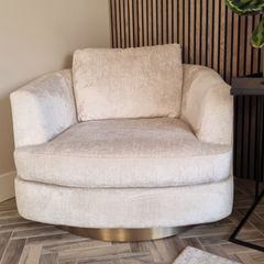 Cream chenille swivel cuddler / armchair