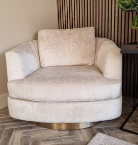 Cream chenille swivel cuddler / armchair