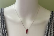 Delicate silver tone chain necklace with red pendant