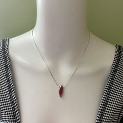 Delicate silver tone chain necklace with red pendant