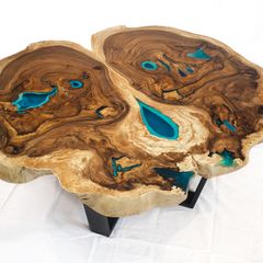 Round live edge coffee table glowing in the dark