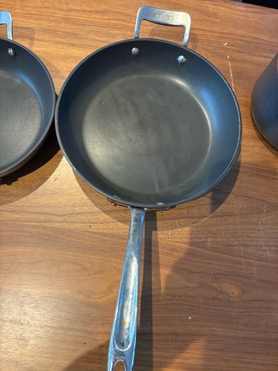 Set of All Clad pots and pans
