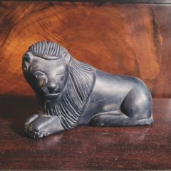 Antique carved Winking Lion