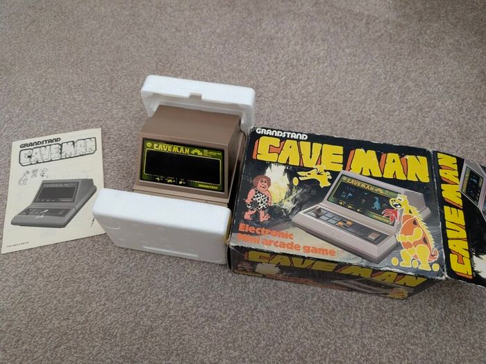 Grandstand Cave man handheld for repair