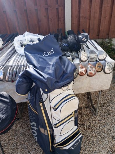 A selection of golf clubs and bags. All right handed clubs.