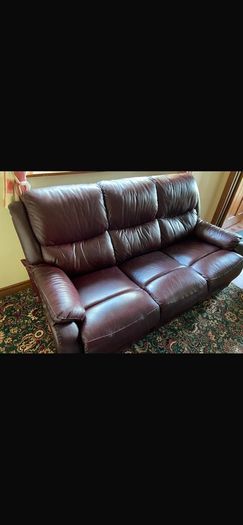 Burgundy comfy couch and arm chair