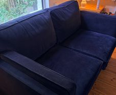 Two seater couch in navy velvet for sale