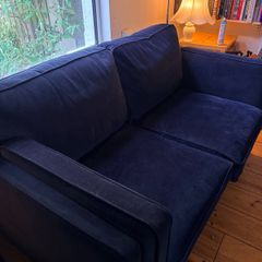 Two seater couch in navy velvet for sale