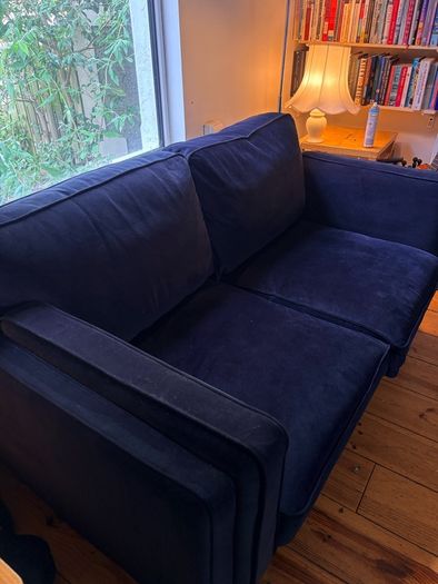 Two seater couch in navy velvet for sale