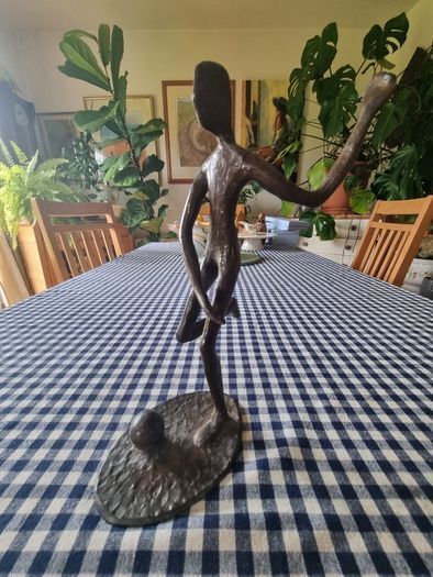 Vintage brass figurine of a football player