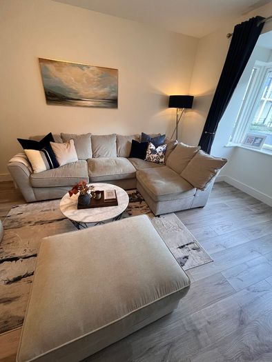 Comfortable L- shaped grey sofa