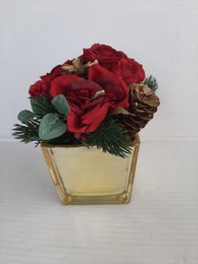 New artificial flower arrangement in vase tag attached