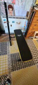 Weight bench with adjustable barbell rack
