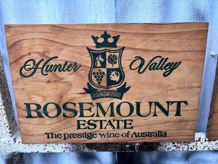 Matching pair of wooden wine plaques