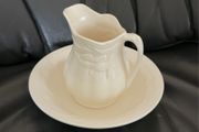 An antique Weatherby Design ironstone pitcher and bowl set featuring a wheat pattern.