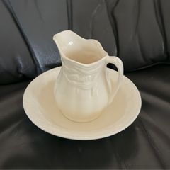 An antique Weatherby Design ironstone pitcher and bowl set featuring a wheat pattern.