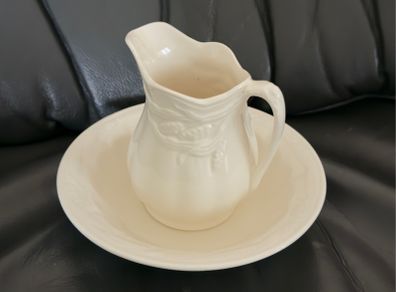 An antique Weatherby Design ironstone pitcher and bowl set featuring a wheat pattern.