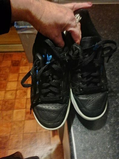 beautiful black leather Adidas runners