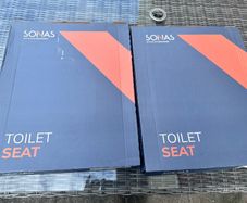 Two Sonas Alpha toilet seats