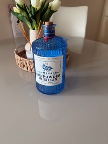 Blue gunpowder gin bottle with cork string lights