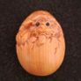Carved wooden dragon hatching from an egg. Image 6
