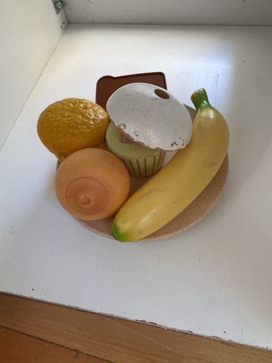 kids play kitchen by Plum with wooden food accessories
