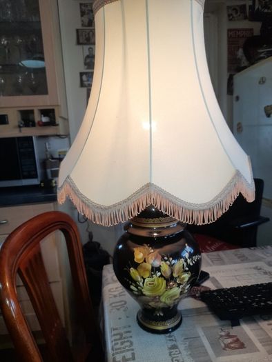 Beautiful Old Large Creamic Table Lamp  Hand Painted Floral Motifs Decorative Chinoiserie Inspired, and a Cream Colored Fabric Shade with Fringed Edging.