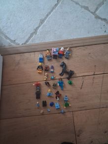 Big box of lego with mini figurines open to offers