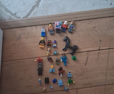 Big box of lego with mini figurines open to offers