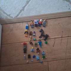Big box of lego with mini figurines open to offers