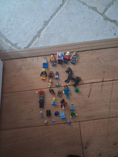 Big box of lego with mini figurines open to offers