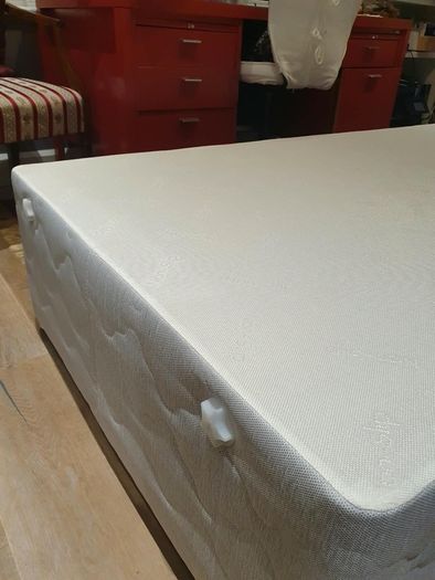 Single divan bed with pristine clean mattress and space for headboard