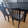 Black dining table with four chairs Image 3