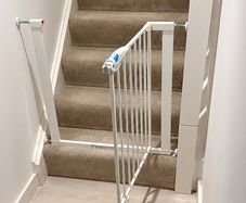 Adjustable baby safety gate and Vtech walker