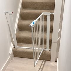 Adjustable baby safety gate and Vtech walker