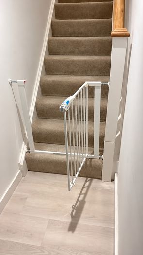 Adjustable baby safety gate and Vtech walker