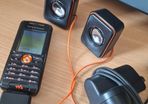 Sony Ericsson W200i , with charger and speakers.