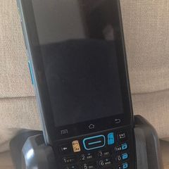 The item is a Unitech EA320 handheld barcode scanner