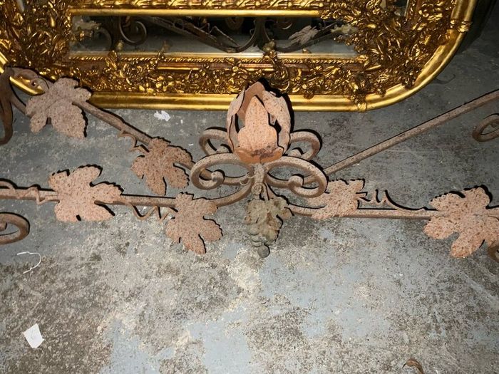 This is an old wrought iron, console table