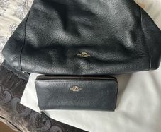 Coach pebbled leather bag and matching wallet.