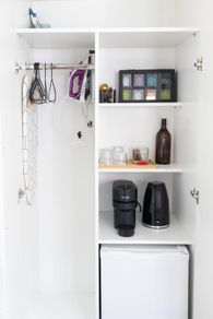 Hairdryer, Kettle, Iron, Iron Table, Nespresso vertuo pop, Mini fridge, glasswear. All what you see in the picture