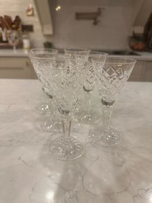 Waterford crystal sherry glasses with a classic cut-crystal design and elegant faceted stems.