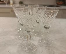Waterford crystal sherry glasses with a classic cut-crystal design and elegant faceted stems.