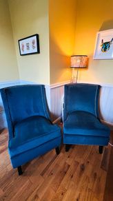 Two stunning navy wingback chairs
