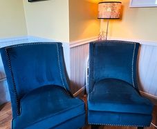 Two stunning navy wingback chairs
